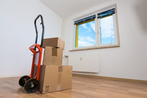 Professional movers loading items for local removals in Parsonsgreen
